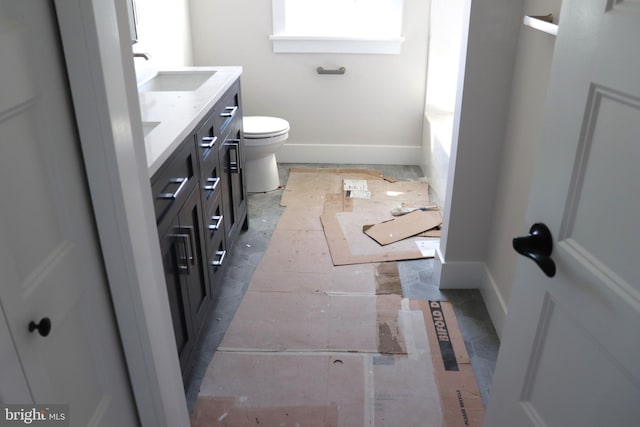 bathroom featuring vanity and toilet