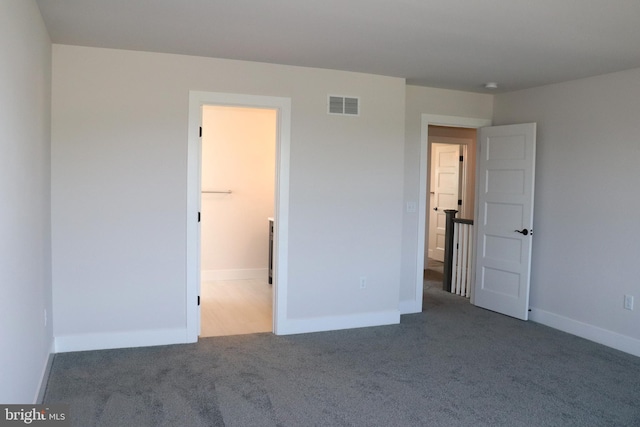 unfurnished bedroom with carpet floors