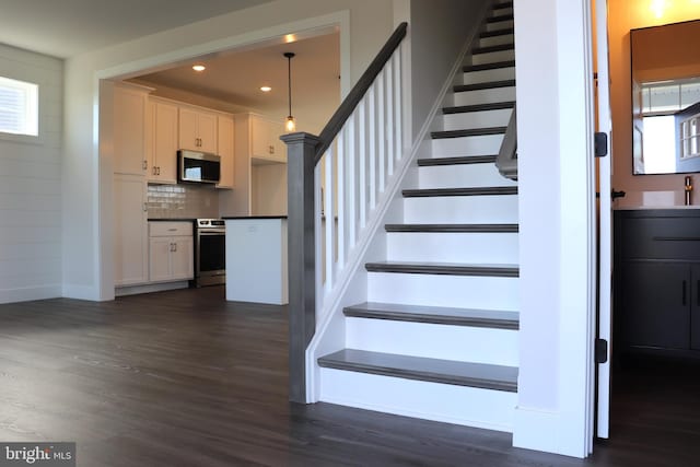 staircase featuring hardwood / wood-style flooring