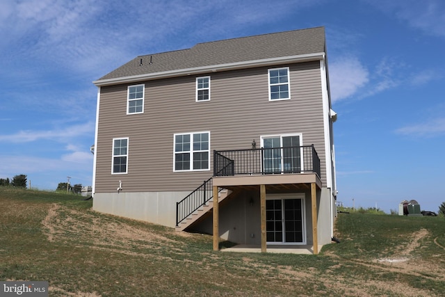 back of property featuring a deck