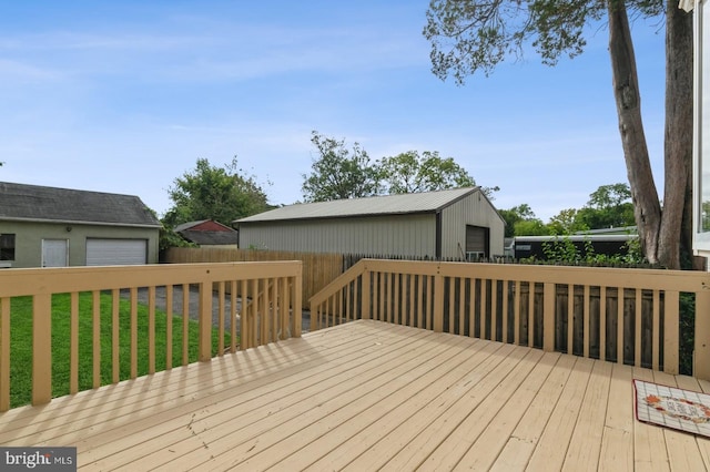 wooden terrace with a lawn and an outdoor structure