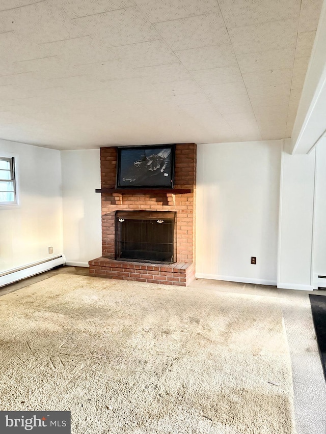 unfurnished living room featuring carpet, baseboards, a fireplace, and a baseboard heating unit