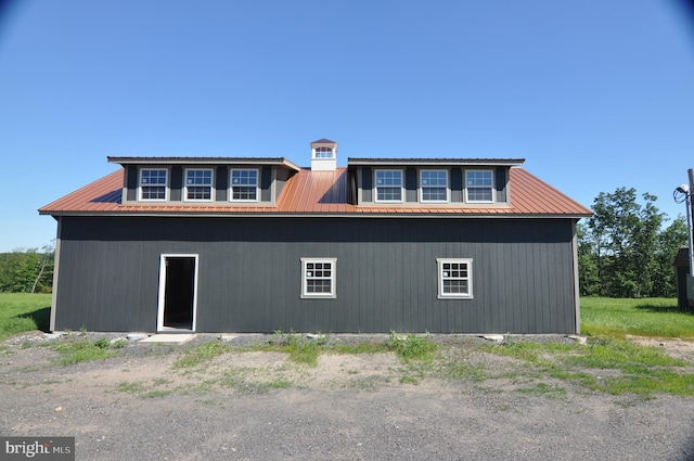 exterior space featuring metal roof