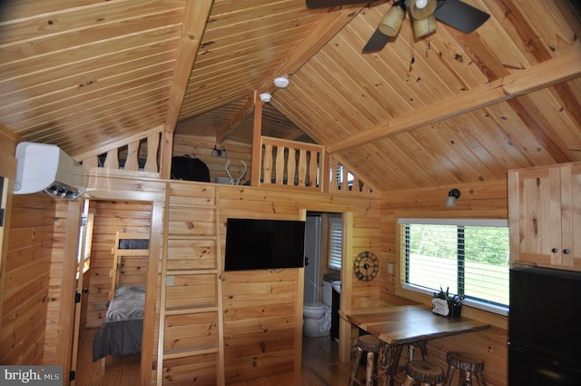 interior space featuring vaulted ceiling with beams, wooden ceiling, wood walls, and wood finished floors