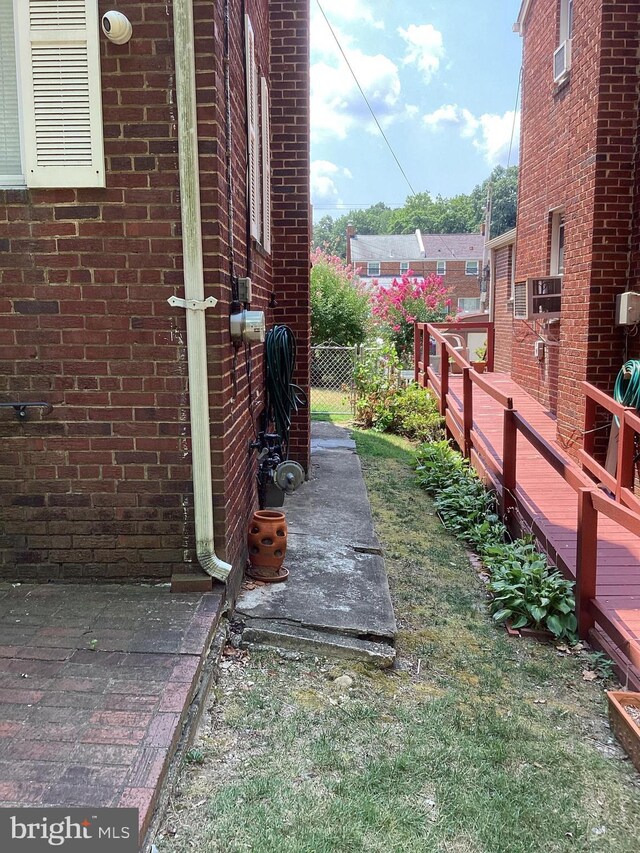 view of yard featuring a wooden deck