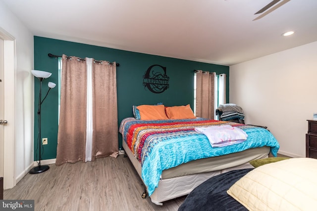 bedroom with light hardwood / wood-style flooring