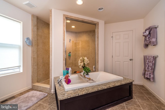 bathroom featuring independent shower and bath and sink