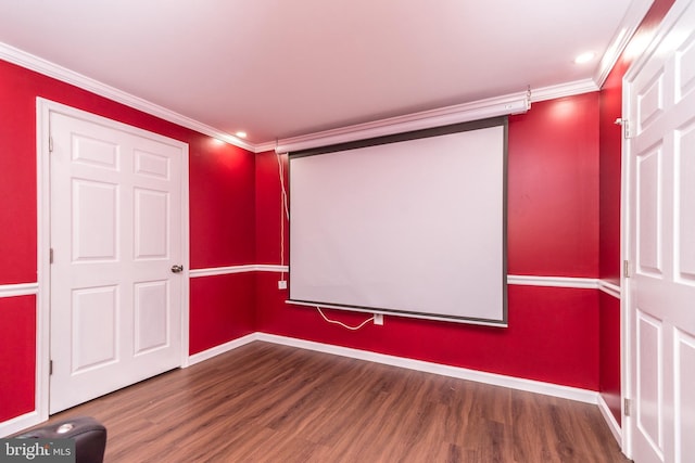 home theater featuring hardwood / wood-style floors and crown molding