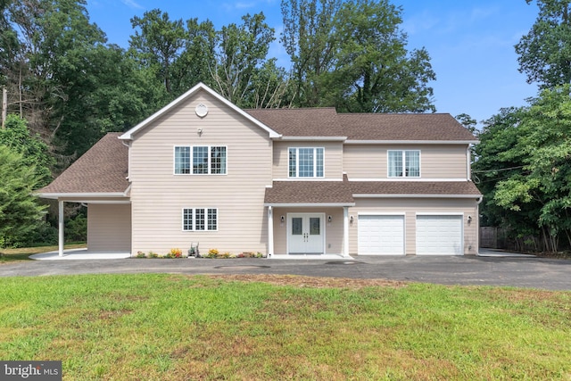 view of front facade featuring a garage and a front yard