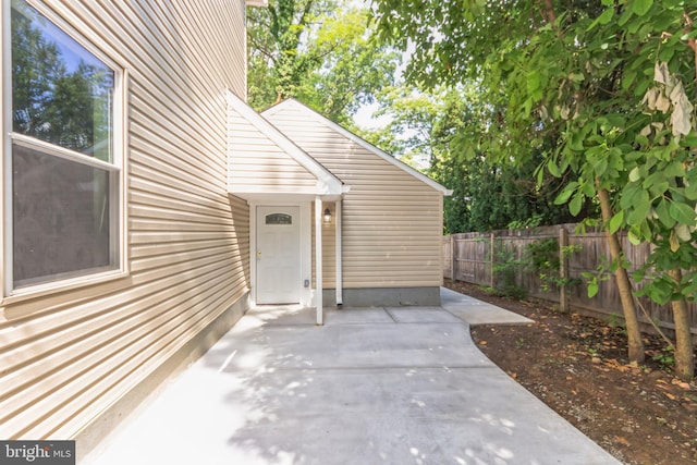 entrance to property featuring a patio area