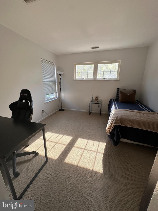 bedroom with light carpet