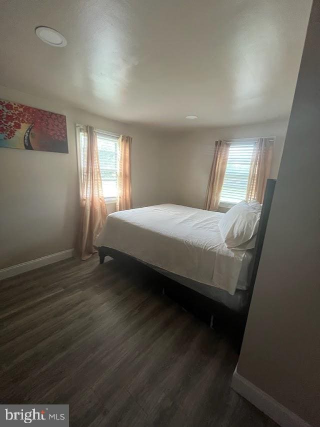 bedroom featuring dark hardwood / wood-style flooring