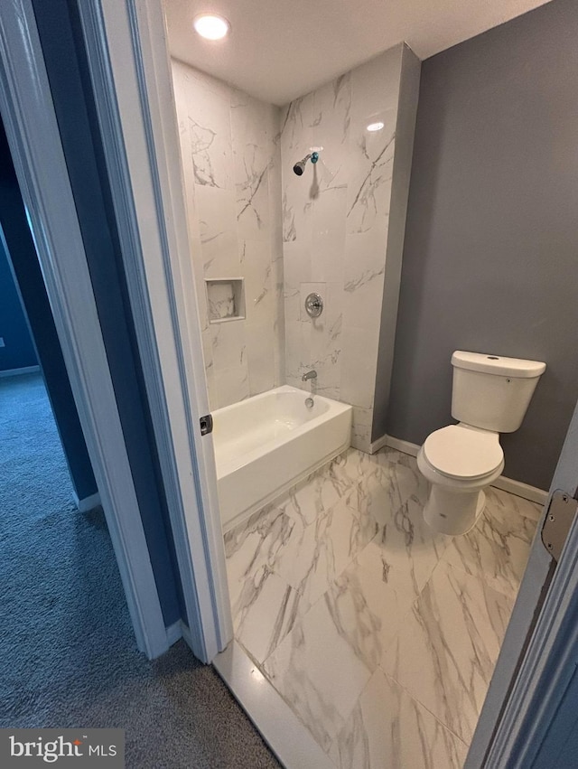 bathroom with shower / bath combination and toilet