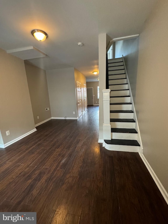 staircase featuring hardwood / wood-style floors