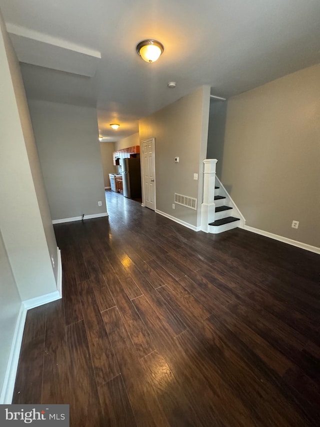 empty room featuring dark hardwood / wood-style flooring