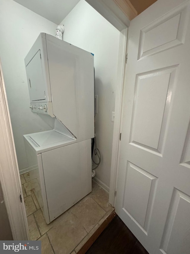 laundry room featuring stacked washing maching and dryer