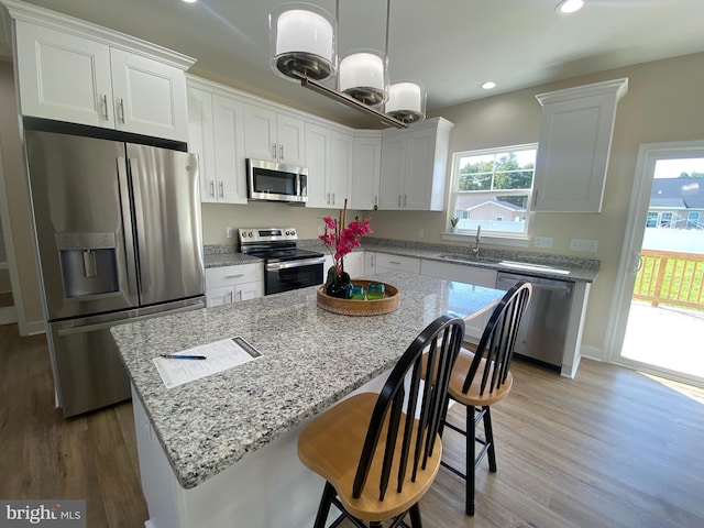 kitchen with sink, white cabinetry, and stainless steel appliances