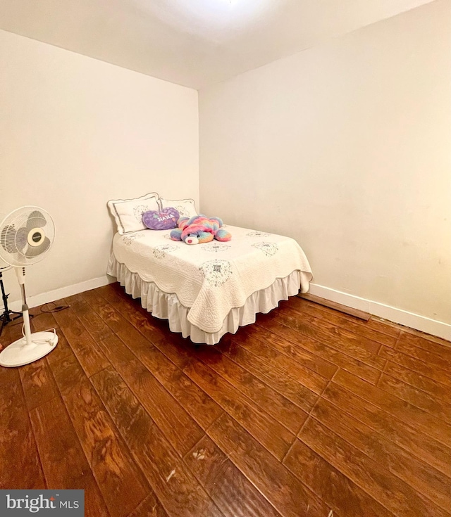 bedroom featuring dark hardwood / wood-style flooring