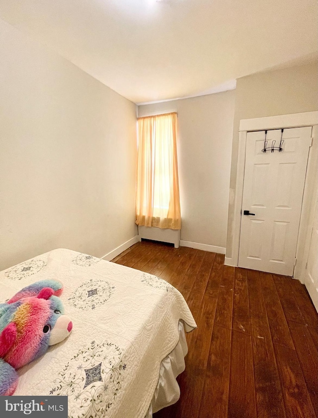 bedroom featuring dark hardwood / wood-style floors