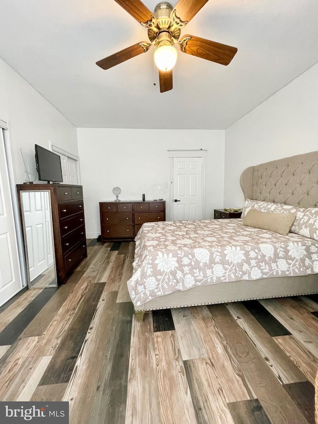 bedroom featuring ceiling fan and wood-type flooring