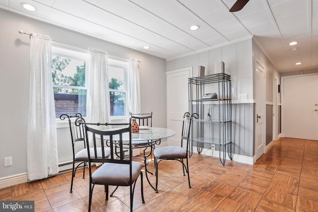 dining room featuring ceiling fan and crown molding