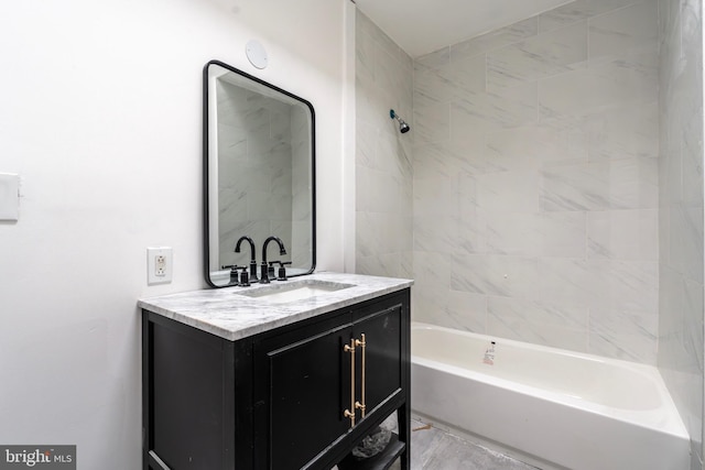 bathroom featuring vanity and tiled shower / bath combo