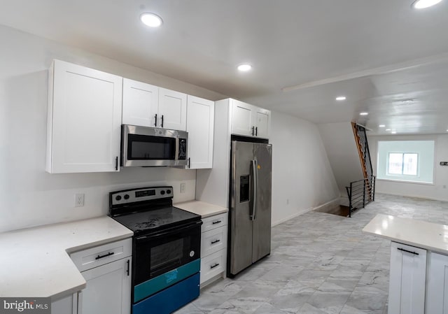 kitchen featuring white cabinetry and stainless steel appliances