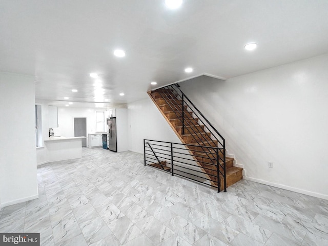 interior space with stainless steel fridge and sink