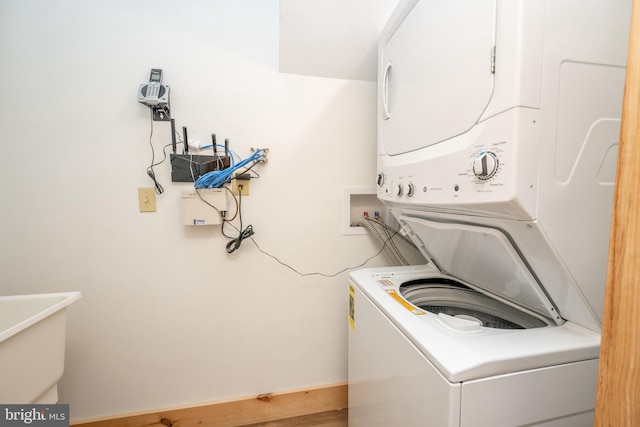 laundry area with stacked washer / dryer