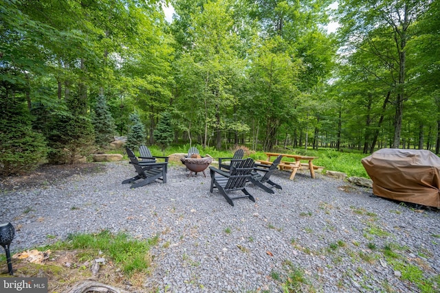 view of patio / terrace featuring a grill and an outdoor fire pit