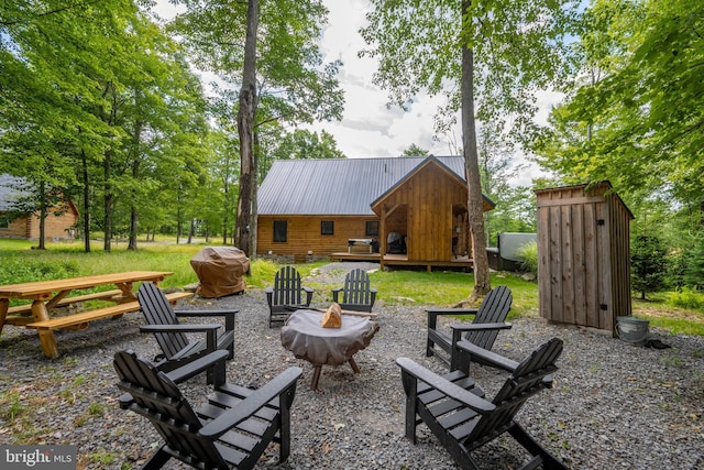 view of patio / terrace with an outdoor fire pit and grilling area