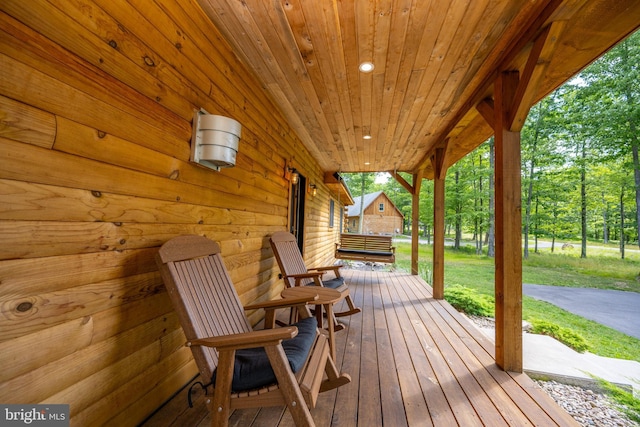 wooden terrace with a porch