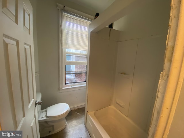 bathroom with a bathing tub and toilet