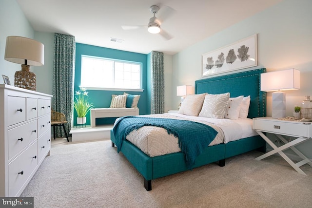 carpeted bedroom with ceiling fan