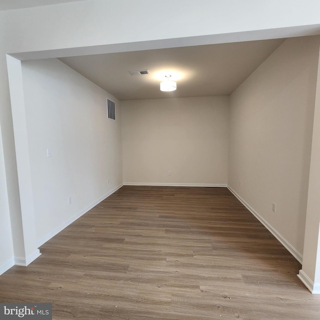 basement with wood-type flooring