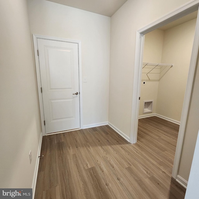 laundry room with light wood-type flooring