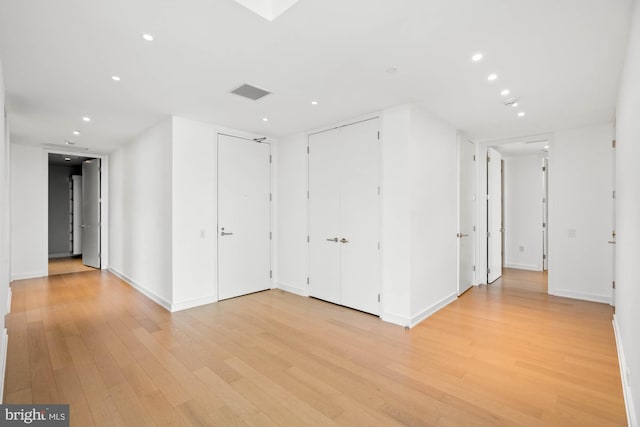 unfurnished room featuring light hardwood / wood-style floors