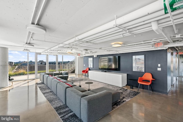 living room with concrete flooring