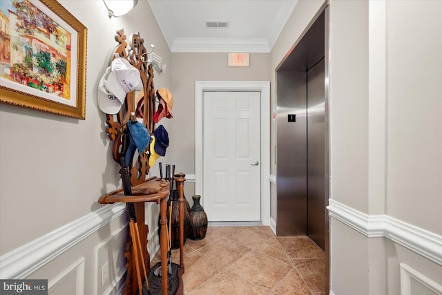 interior space featuring crown molding, elevator, and light tile patterned floors