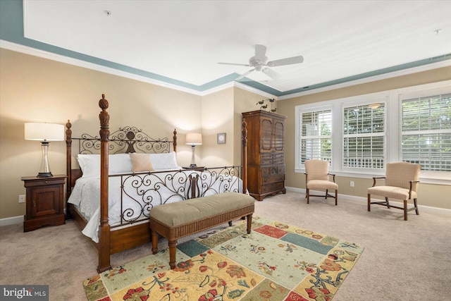 carpeted bedroom with ceiling fan and ornamental molding