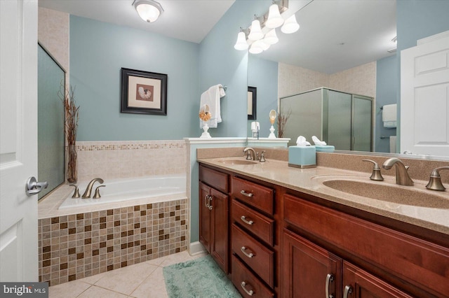 bathroom featuring plus walk in shower, tile patterned flooring, and vanity