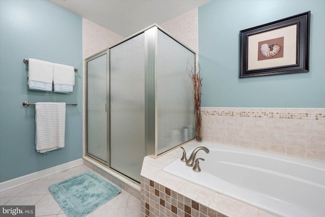 bathroom featuring tile patterned flooring and shower with separate bathtub