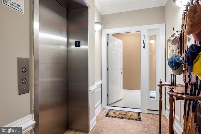 interior space with light tile patterned flooring, elevator, and ornamental molding