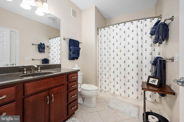 full bathroom with toilet, vanity, shower / tub combo, and tile patterned floors