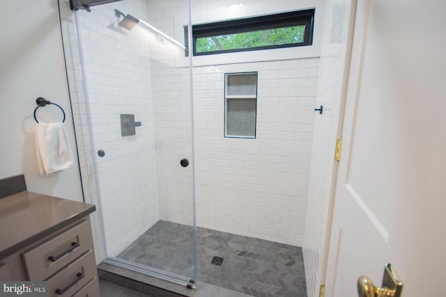 full bathroom with a stall shower and vanity