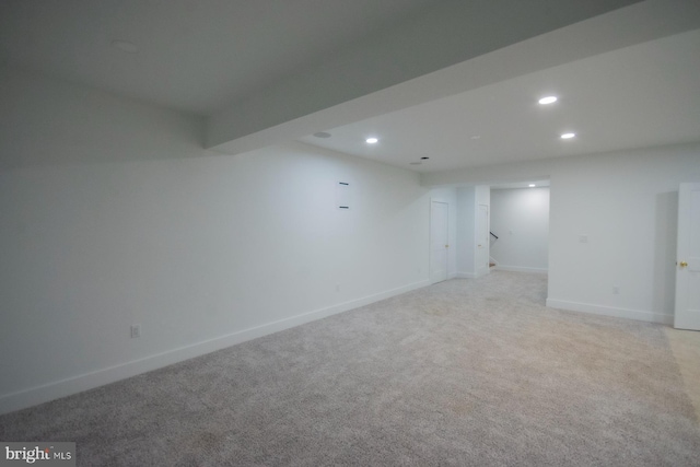 interior space featuring light carpet, baseboards, and recessed lighting