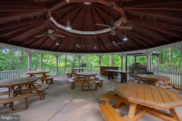 view of patio with ceiling fan, a gazebo, and area for grilling