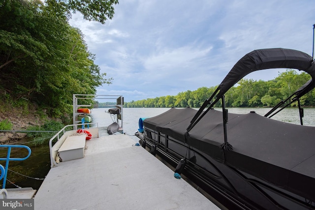 view of patio / terrace featuring a water view and a forest view