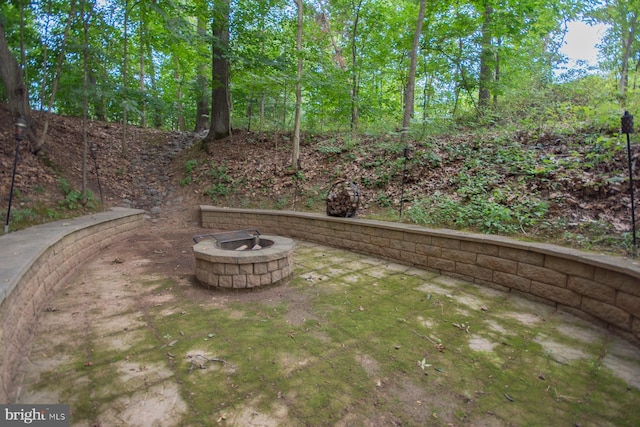 view of yard with an outdoor fire pit