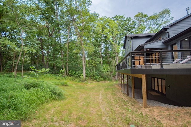 view of yard with a wooden deck